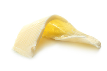 Butter curl on white background