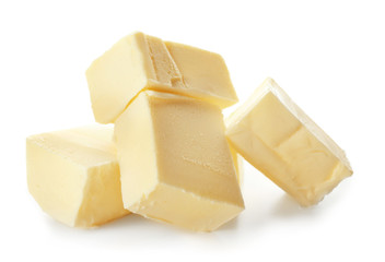 Pieces of butter on white background