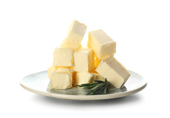 Plate with pieces of butter on white background