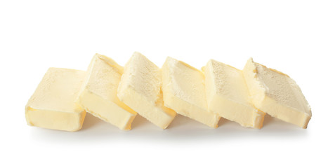 Pieces of butter on white background