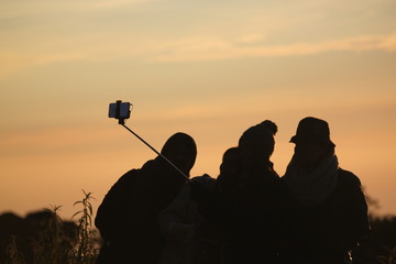 silhouette of photographer at sunset