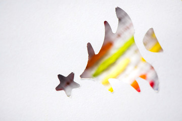 Creative workshop for kids. Embroidery fabric with hand embroidered colorful elements. Cut Christmas tree with star. Kids learning to do creative crafts at school, cut decorations  