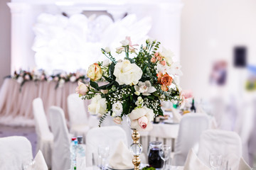 The wedding decor. The white flowers bouquet.