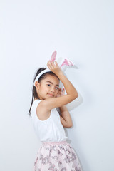Little girl bunny ears studio wall