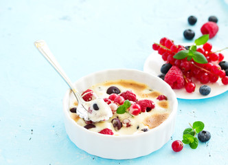 Zabaglione with champagne and berries. French dessert.