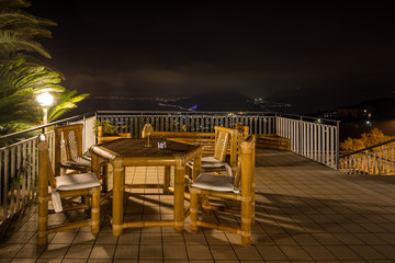 Chairs and table on the terrace overlooking the Bay of Naples and  Vesuvius. Sorrento. Italy