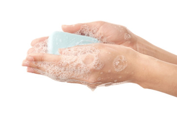 Woman washing hands on white background