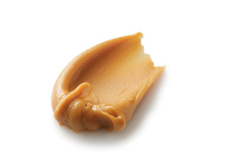 Tasty peanut butter on white background