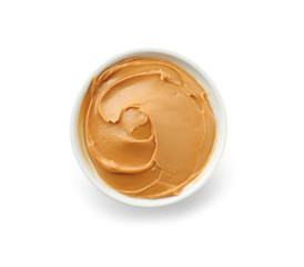 Tasty peanut butter in bowl on white background