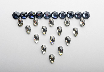 Composition with precious stones for jewellery on white background