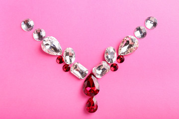 Composition with precious stones for jewellery on color background