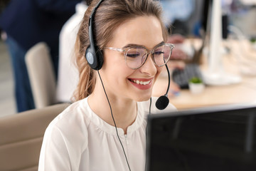 Female technical support agent working in office