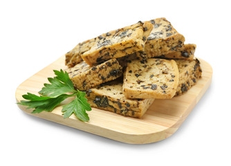 Wooden board with tasty tofu cheese on white background