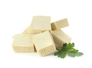 Cut tofu cheese on white background