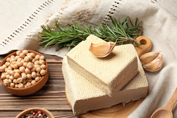 Tasty tofu cheese on wooden background