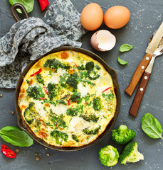Frittata with vegetables and broccoli. View from above. Selective focus.