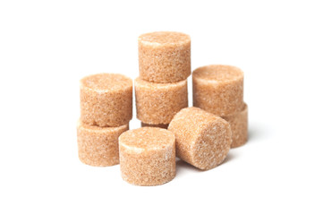 group of brown cane sugar in shaped circle on white background