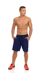 Fototapeta premium Half Naked Fit Man Is Standing With Hands In Pockets