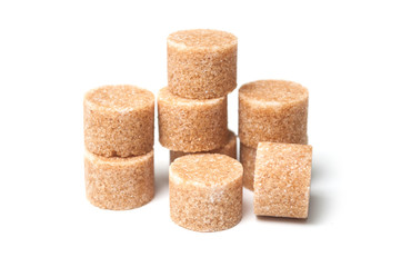 group of brown cane sugar in shaped circle on white background