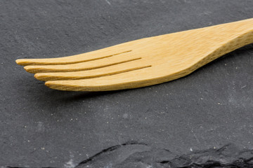 wooden fork on slate griddle for cooking