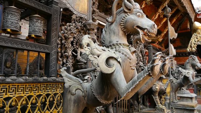 Ancient bronze and brass mythological sculptures and artifacts, Rudra Varna Mahavihar, unique golden buddhist temple in Lalitpur (Patan). World heritage site. Tibetan buddhism. Durbar Square, Nepal.