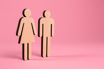 Female and male figures on color background. Concept of transgender
