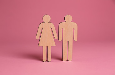 Female and male figures on color background. Concept of transgender