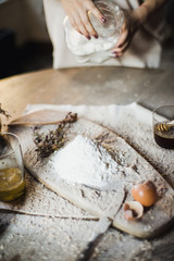 Preparation of the dough on a wooden background