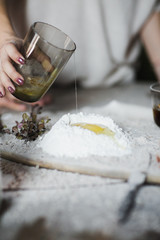 Preparation of the dough on a wooden background