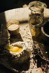 Preparation of the dough on a wooden background