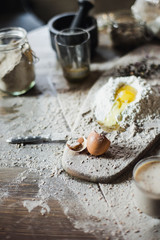 Preparation of the dough on a wooden background