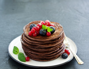 Chocolate pancakes with berries.