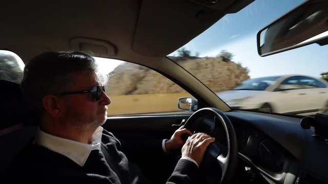 Interior view of a man driving
