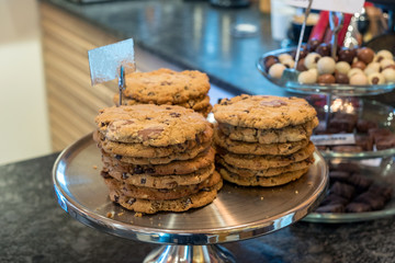 Chocolate chips cookies stacked on aluminium tray
