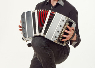 GOMEL, BELARUS - FEBRUARY 14, 2019: a bandoneon musical instrument in the hands of a musician.