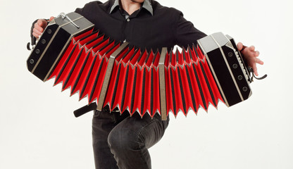 GOMEL, BELARUS - FEBRUARY 14, 2019: a bandoneon musical instrument in the hands of a musician.