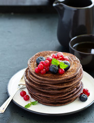 Chocolate pancakes with berries.
