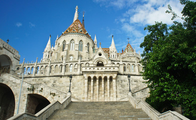 Fototapeta na wymiar Scenic view of stairs of Fisherman's Bastion and Matthias church in the morning, Castle hill in Buda, beautiful architecture, sunny day, Budapest, Hungary