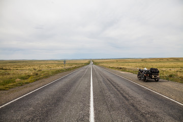 Sidecar motorcycle on an empty stretch of road