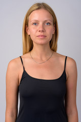 Fototapeta premium Face of young beautiful blonde woman looking at camera