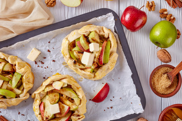 open apple pies, galettes with apple slices