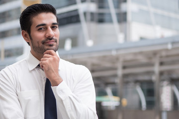 asian business man thinking; portrait of Asian, north indian successful and confident businessman thinking, planning, looking, having future project