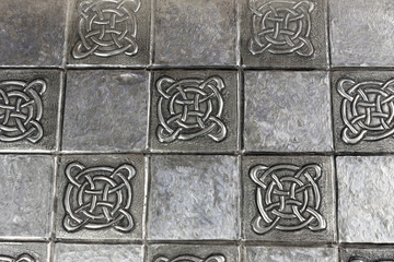 texture with embossed drawing on tin foil