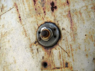 old button on rusty door