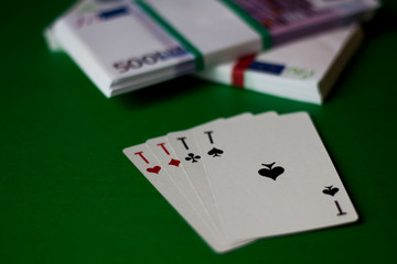 cards and money on the green table