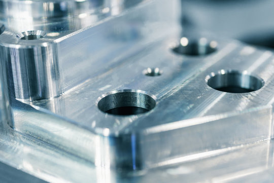 Detail of aluminum machined parts, shiny surface.