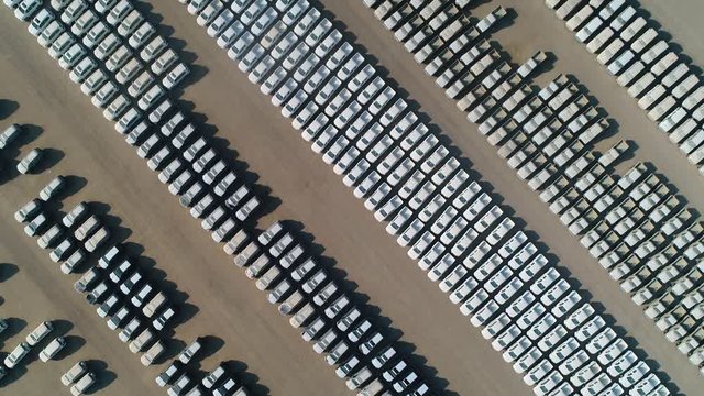 Aerial view of group of cars at parking space on a desert landscape, U.A.E.
