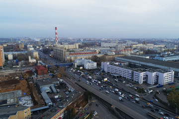 Aerial view of the city district. A wide road passes through the city