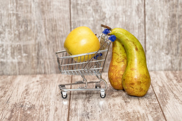 family trip to the supermarket with a cart and a child