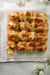 Spring hot cross buns on wood
